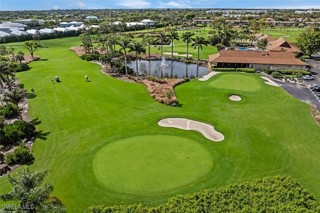 aerial view with a water view and golf course view