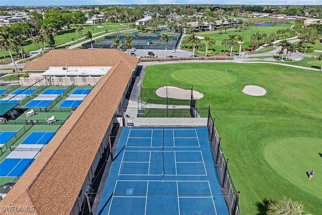 birds eye view of property with view of golf course