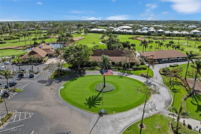 aerial view with a residential view and view of golf course