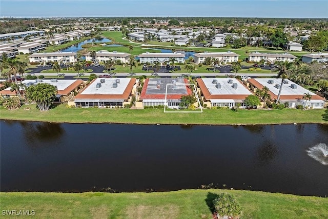 aerial view featuring a residential view and a water view