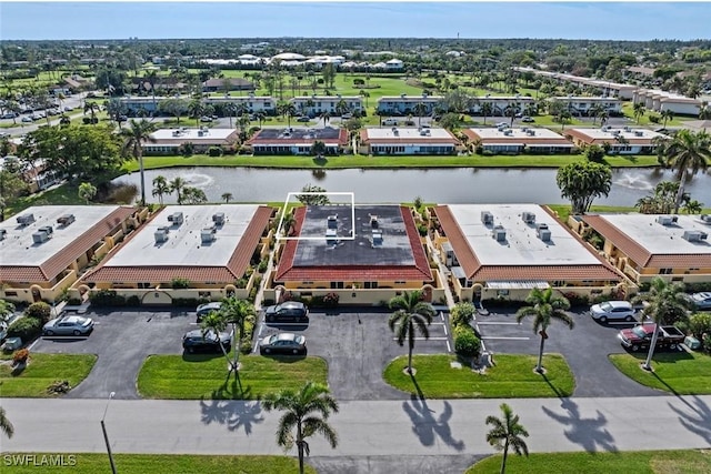 aerial view with a residential view and a water view