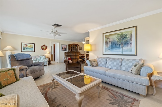 living room featuring ceiling fan, light tile patterned floors, and crown molding