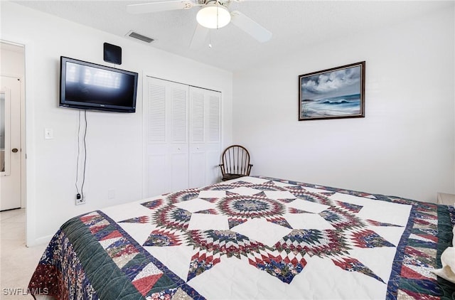 bedroom featuring ceiling fan and a closet