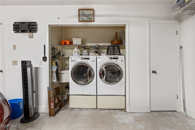 laundry area with separate washer and dryer