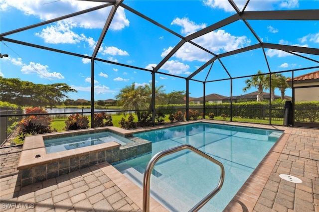 view of swimming pool with glass enclosure and an in ground hot tub