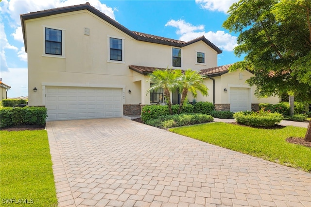 mediterranean / spanish-style home featuring a garage