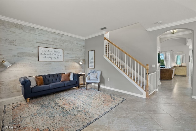 tiled living room featuring tile walls and ornamental molding