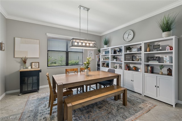 tiled dining room featuring ornamental molding