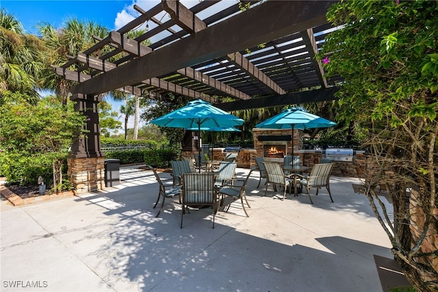 view of patio / terrace featuring a pergola and exterior kitchen