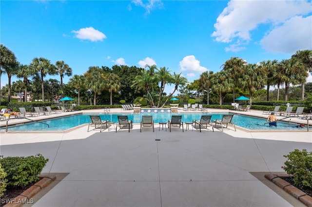 view of swimming pool with a patio