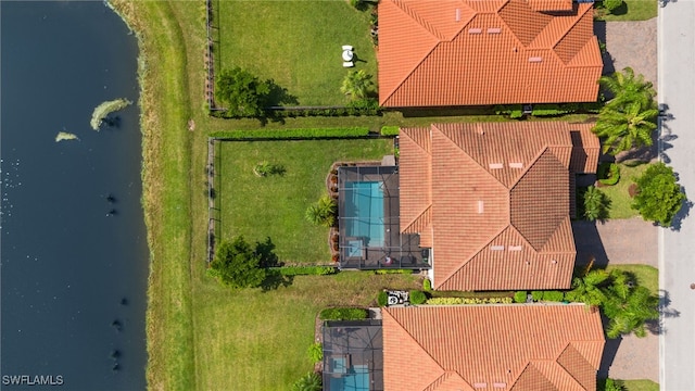 birds eye view of property featuring a water view