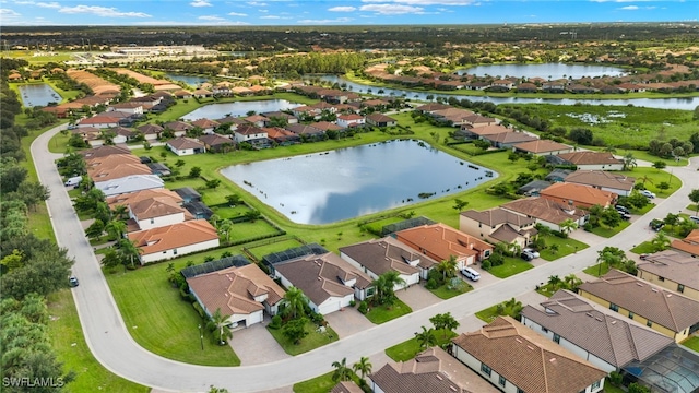 drone / aerial view with a water view