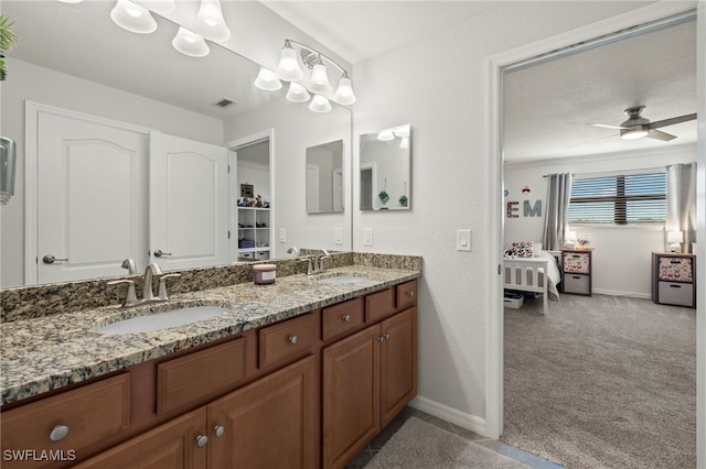 bathroom featuring vanity and ceiling fan