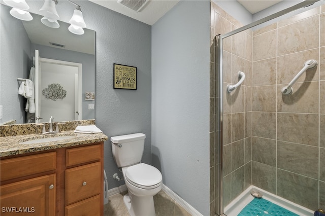 bathroom with vanity, toilet, and walk in shower