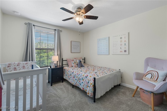 carpeted bedroom with ceiling fan