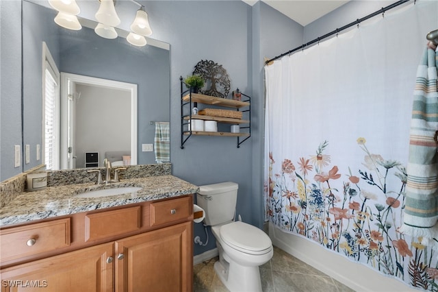 full bathroom featuring tile patterned flooring, vanity, toilet, and shower / tub combo with curtain