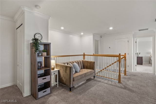 living area with carpet floors and ornamental molding