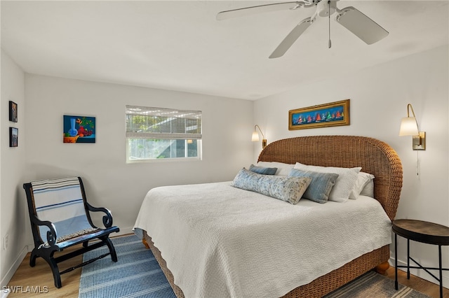 bedroom featuring ceiling fan and wood-type flooring