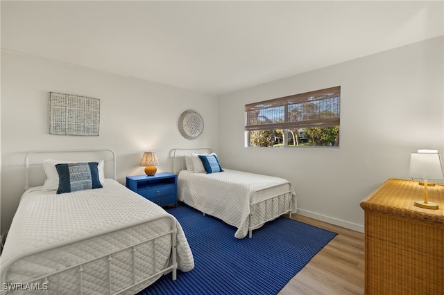 bedroom with light hardwood / wood-style floors