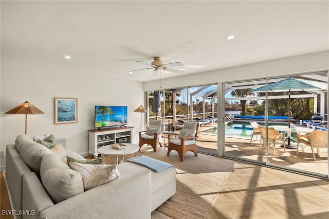 living room with ceiling fan and light parquet floors