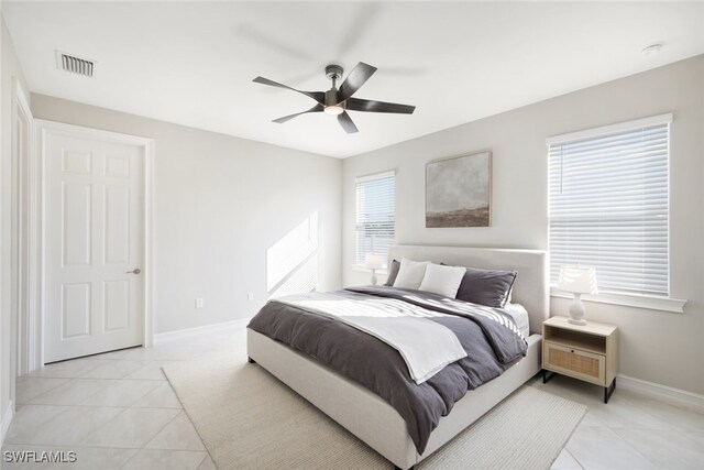 bedroom with light tile patterned floors and ceiling fan