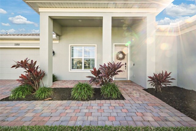 doorway to property featuring a garage