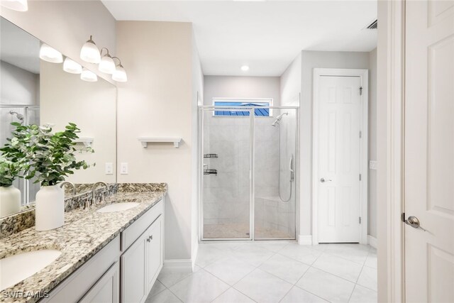 bathroom with walk in shower, tile patterned floors, and vanity