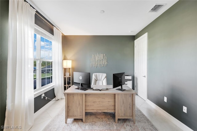 home office with light tile patterned floors