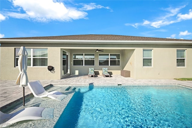 rear view of house with a patio area and ceiling fan