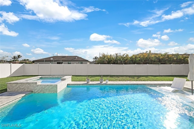 view of pool with an in ground hot tub