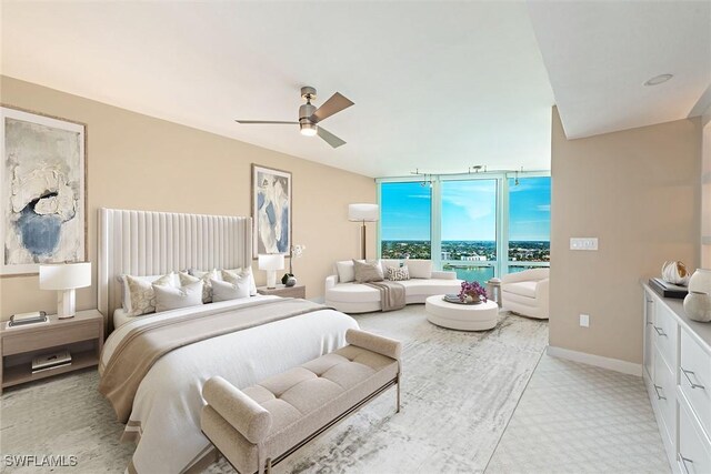 bedroom featuring a ceiling fan and baseboards