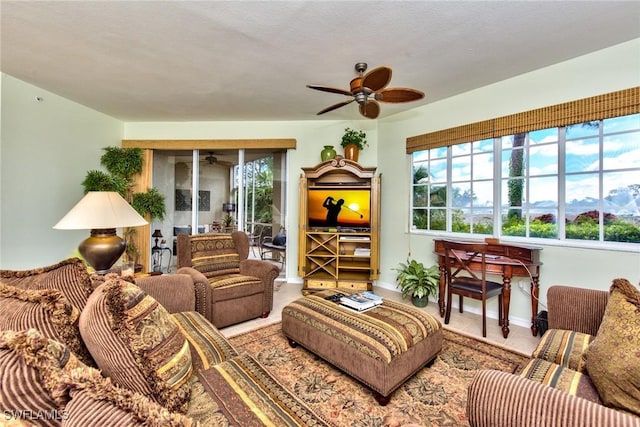 tiled living room featuring ceiling fan