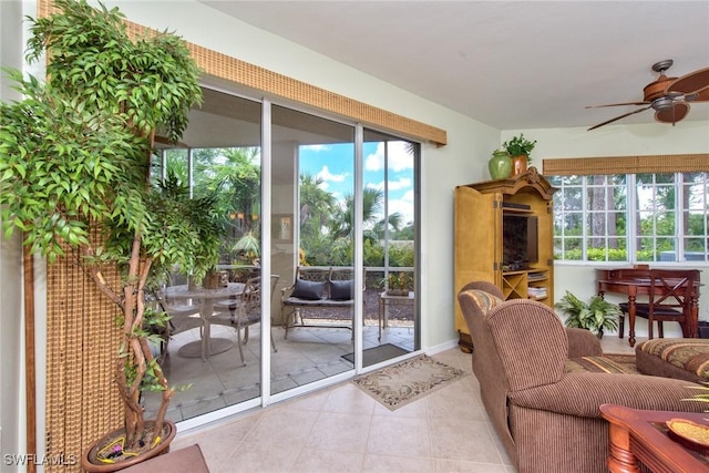 doorway featuring ceiling fan