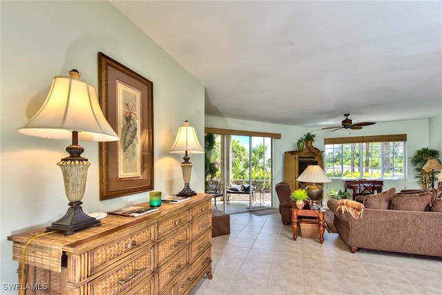 tiled living room with ceiling fan