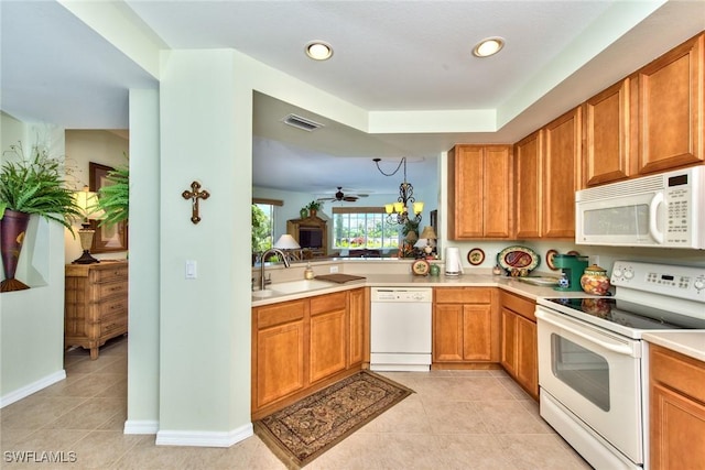 kitchen with ceiling fan, sink, light tile patterned floors, and white appliances