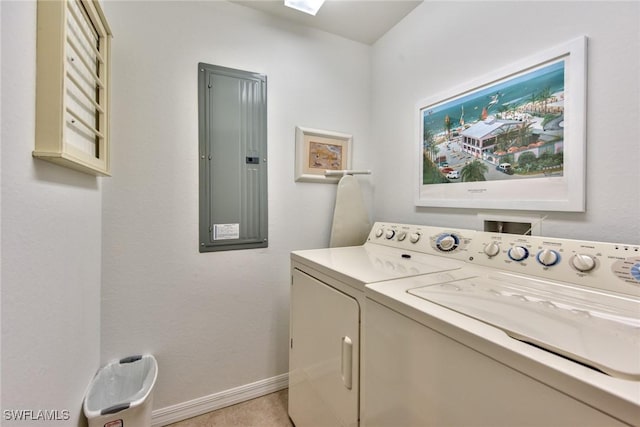 clothes washing area featuring separate washer and dryer and electric panel