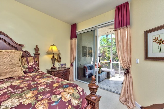 carpeted bedroom featuring access to exterior and a closet