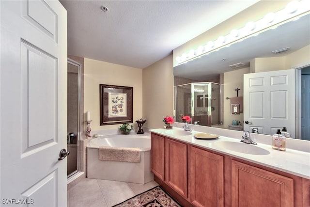 bathroom with vanity, tile patterned floors, and independent shower and bath