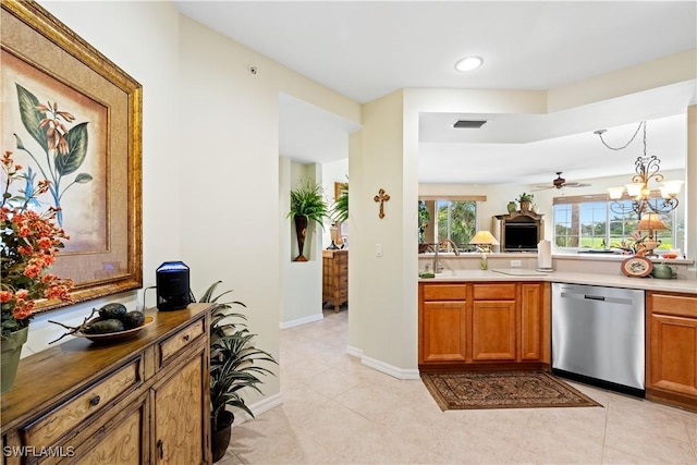 kitchen with a sink, visible vents, brown cabinetry, and dishwasher