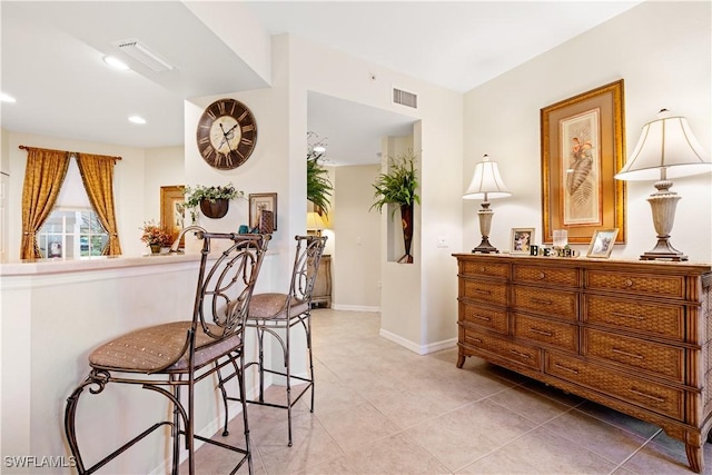 interior space with recessed lighting, visible vents, baseboards, and light tile patterned floors