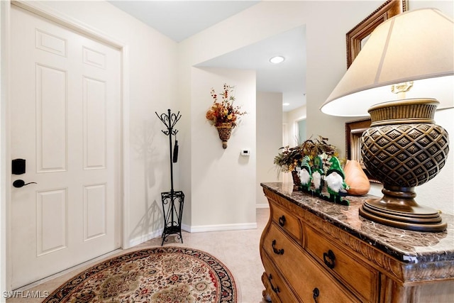 entrance foyer with baseboards and recessed lighting