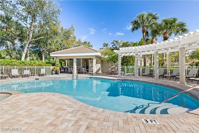 pool with a patio area, fence, and a pergola