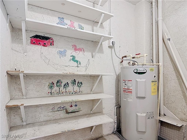 utility room with electric water heater