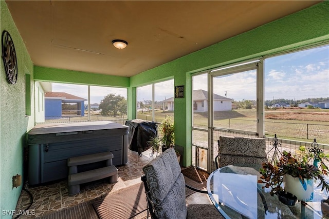 sunroom / solarium featuring plenty of natural light