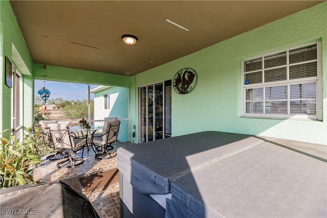 view of patio / terrace featuring a hot tub