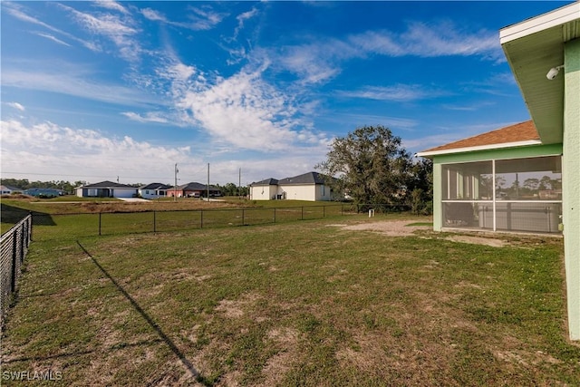 view of yard with a sunroom