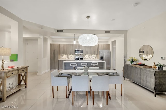 dining space with light tile patterned floors