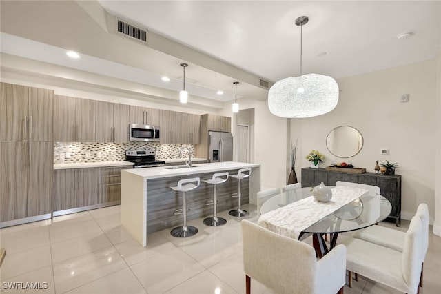 tiled dining area with sink