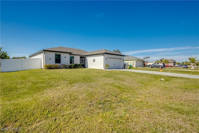 ranch-style house featuring a front yard and a garage