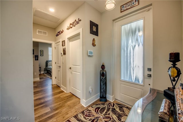 entryway with hardwood / wood-style flooring